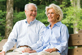 Photo of a couple sitting on a park bench. Link to Gifts of Appreciated Securities. Photo of a couple sitting on a park bench. Link to Gifts of Appreciated Securities.